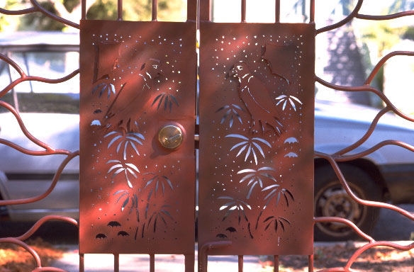 detail of gate handles with bamboo leaf cutouts
