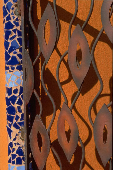 closeup of pattern in metal gate with squiggly lines and cutouts 