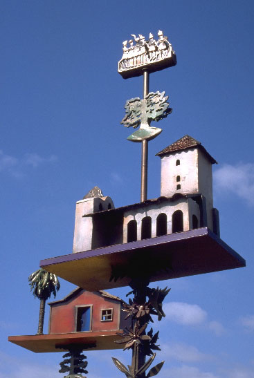 two house sculptures fashioned like weather vanes 